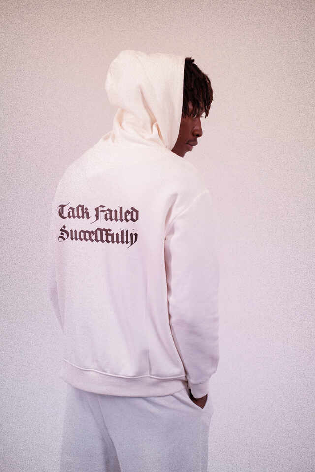Man in hoodie with text “Task failed successfully” set in AJ Quadrata.